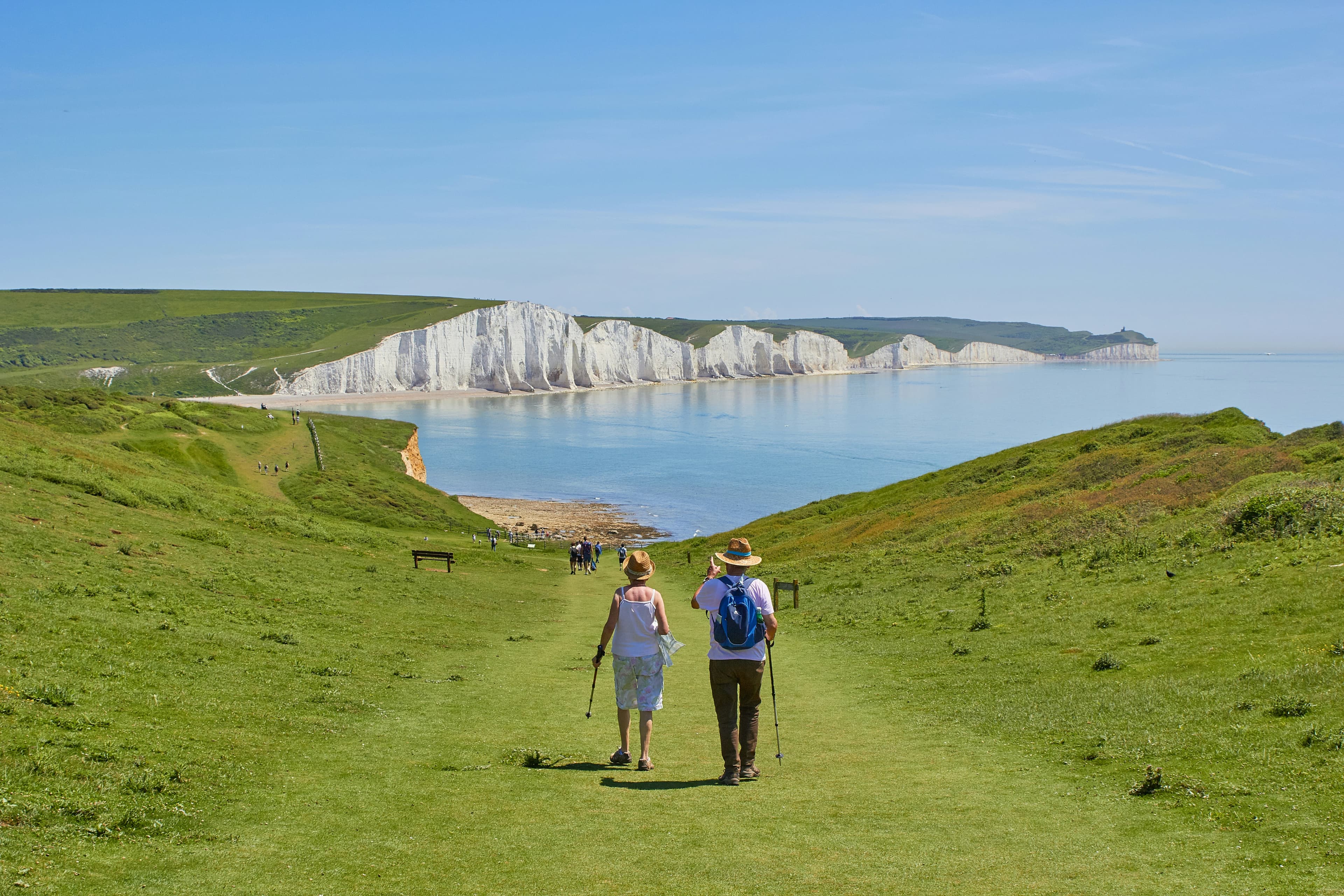 Retirees walking along the French coast